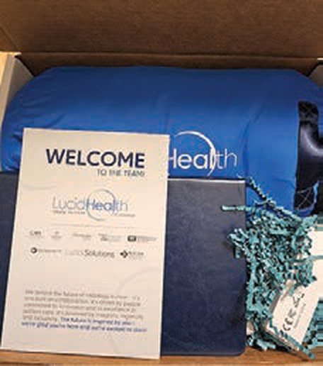 A branded new hire welcome kit packed in a gift box